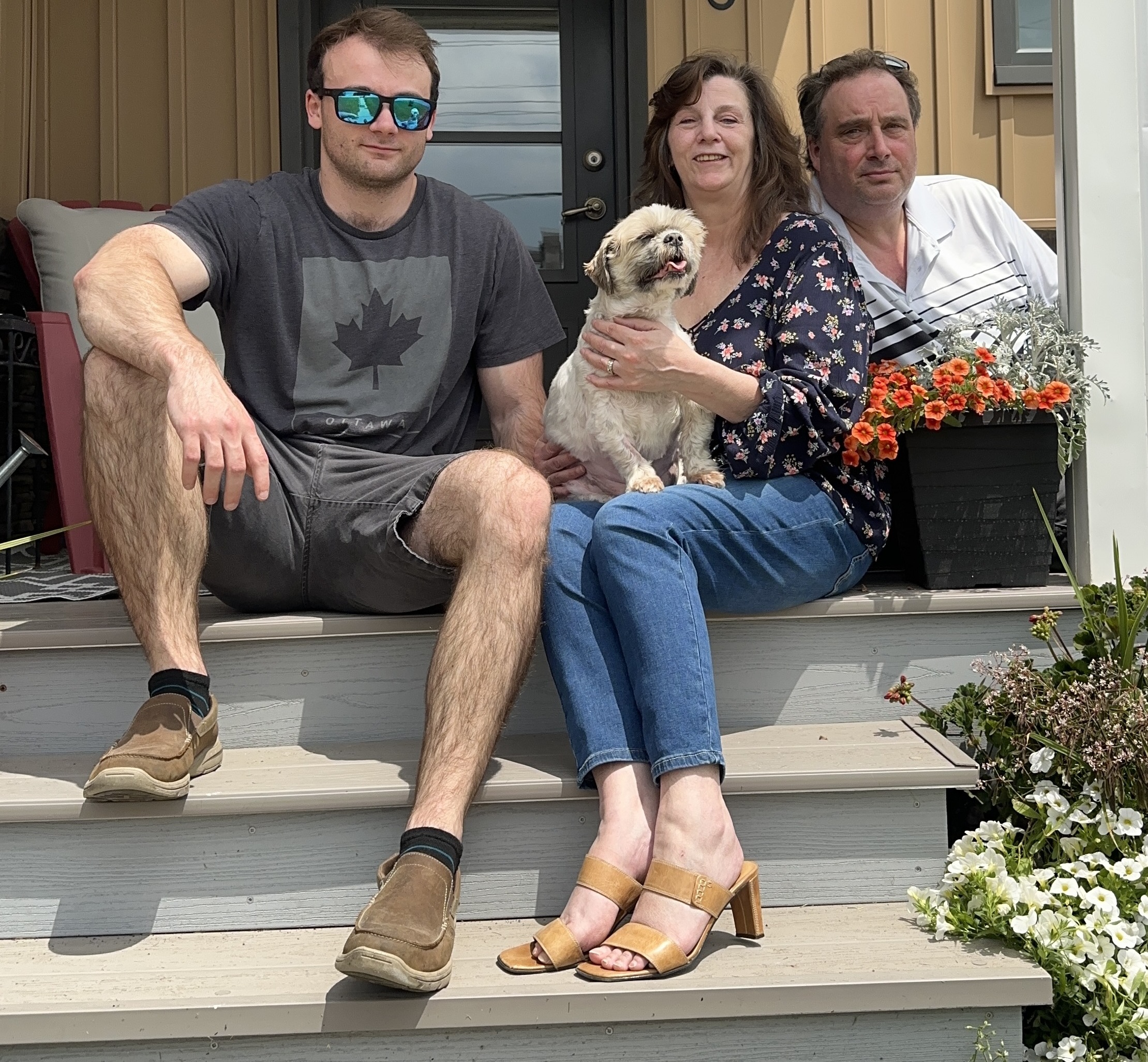 Jeremie Paulin, Lynn Arbuthnot, and Zach Paulin on the front porch.